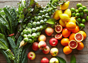 a group of fruits and vegetables on a wood surface Healthy Weight Loss Diets Stratford